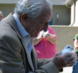 man releasing a dove
